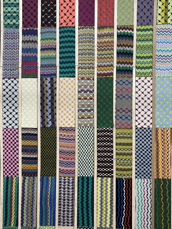 Caption: Depicted here are various patterns that make up the signature keffiyeh. The original colors of the keffiyeh are black and white; however, with its popularization, the Hirbawi factory has created many iterations of the scarf. 